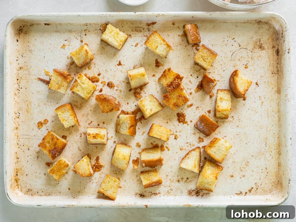 Grilled Shrimp Caesar Salad with Crispy Parmesan Croutons 8 Toasted croutons on a baking sheet.