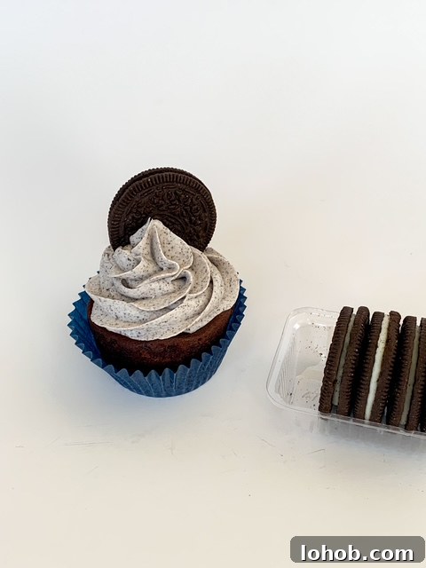 Cookies and Cream Stuffed Layer Cake Recipe 9 finished cookies and cream filled cake with cookie on top