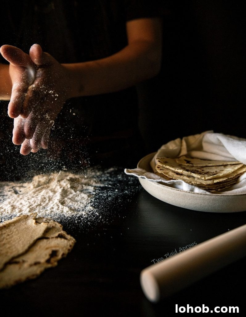 Homemade Corn Tortillas with 3 Simple Ingredients 10 Clapping masa flour together.