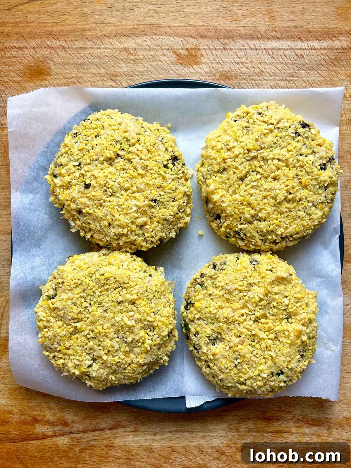Chickpea-Crusted Black Bean Burger Recipe for Crispy Veggie Burgers 14 four chickpea crusted patties on plate