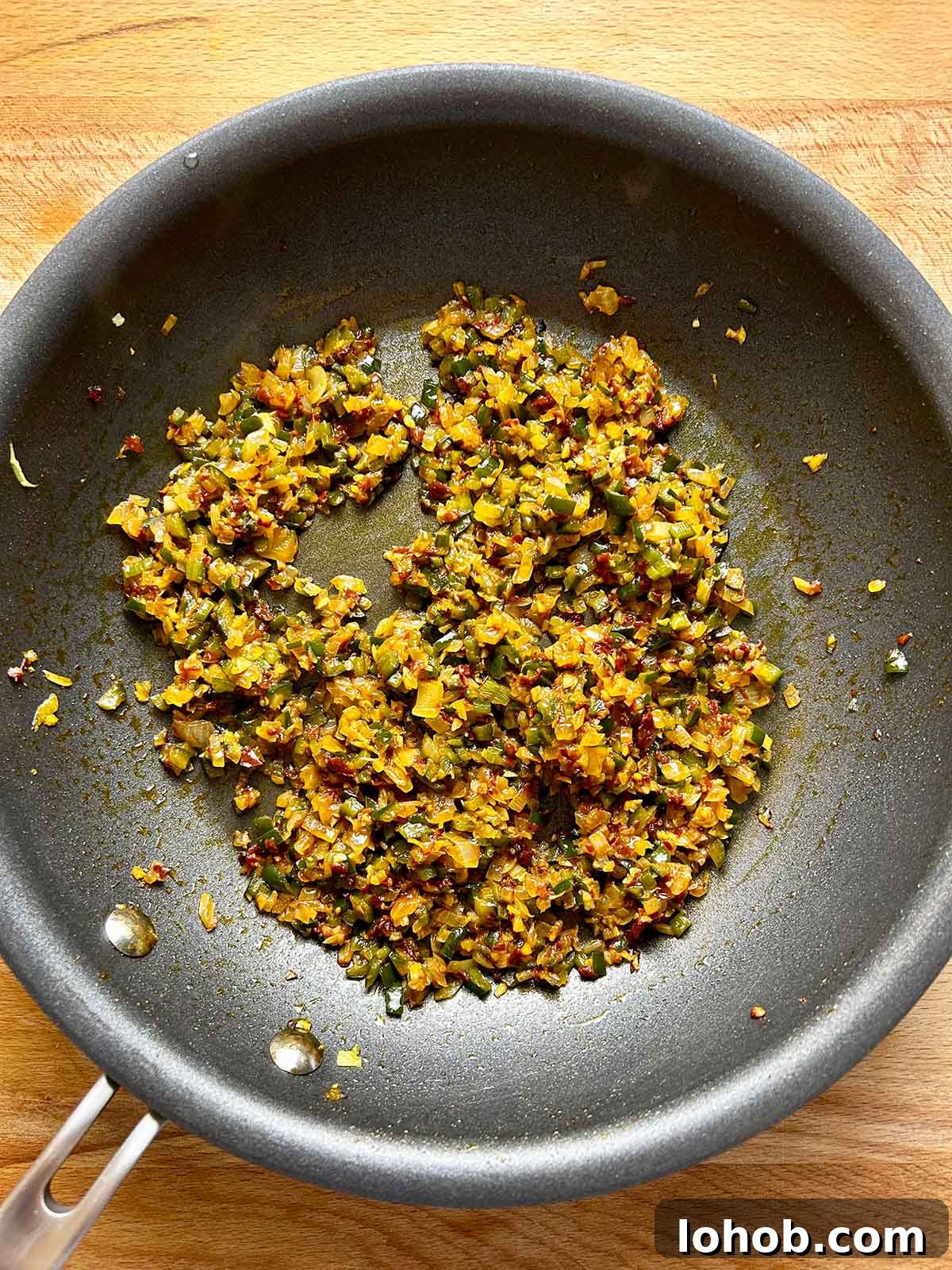 Chickpea-Crusted Black Bean Burger Recipe for Crispy Veggie Burgers 7 onion mixture in pan