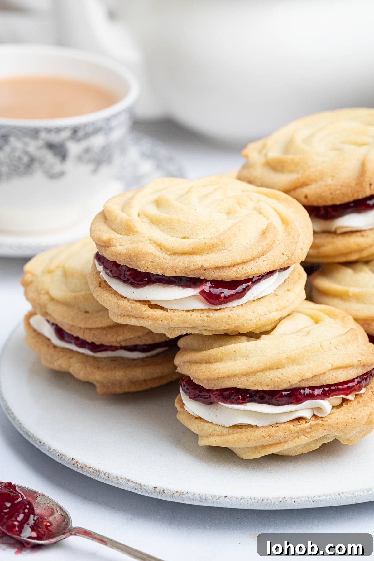 Vegan Viennese Whirls Recipe — Crisp, Buttery Cookies 13 Close up of a plate of vegan Viennese whirls.