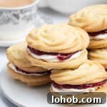 Vegan Viennese Whirls Recipe — Crisp, Buttery Cookies 14 Close up of a plate of vegan Viennese whirls.