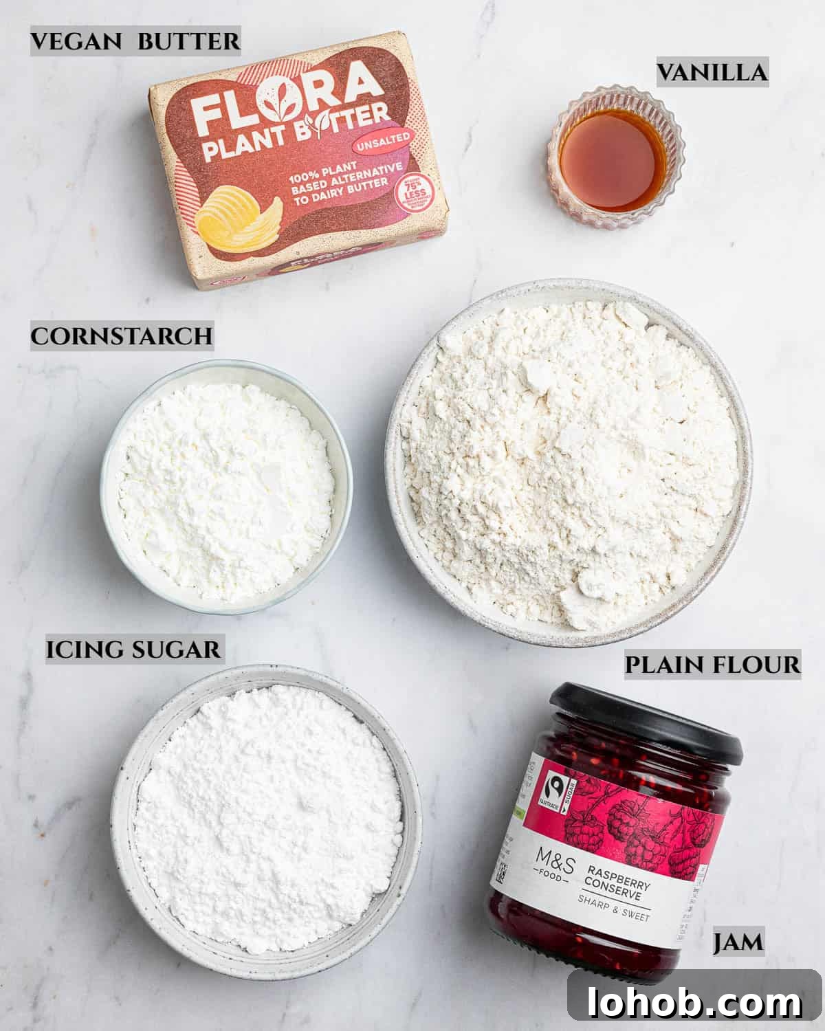 Vegan Viennese Whirls Recipe — Crisp, Buttery Cookies 3 A labelled photo of the ingredients needed to make vegan Viennese whirls.