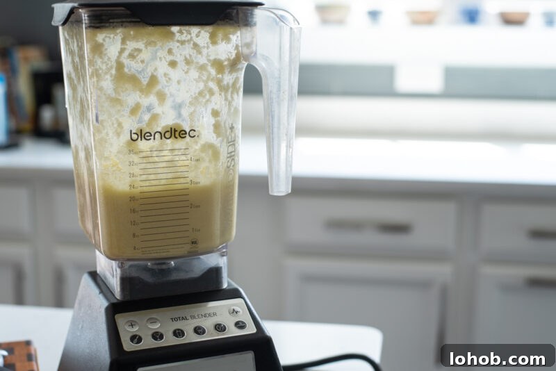 Blender pureeing potato and onion mixture for Korean potato pancake batter
