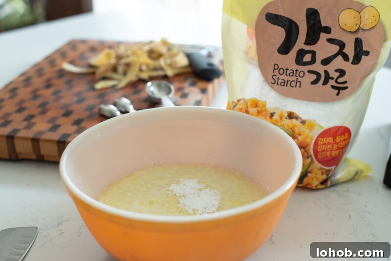 Potato purée mixed with potato starch in a bowl.