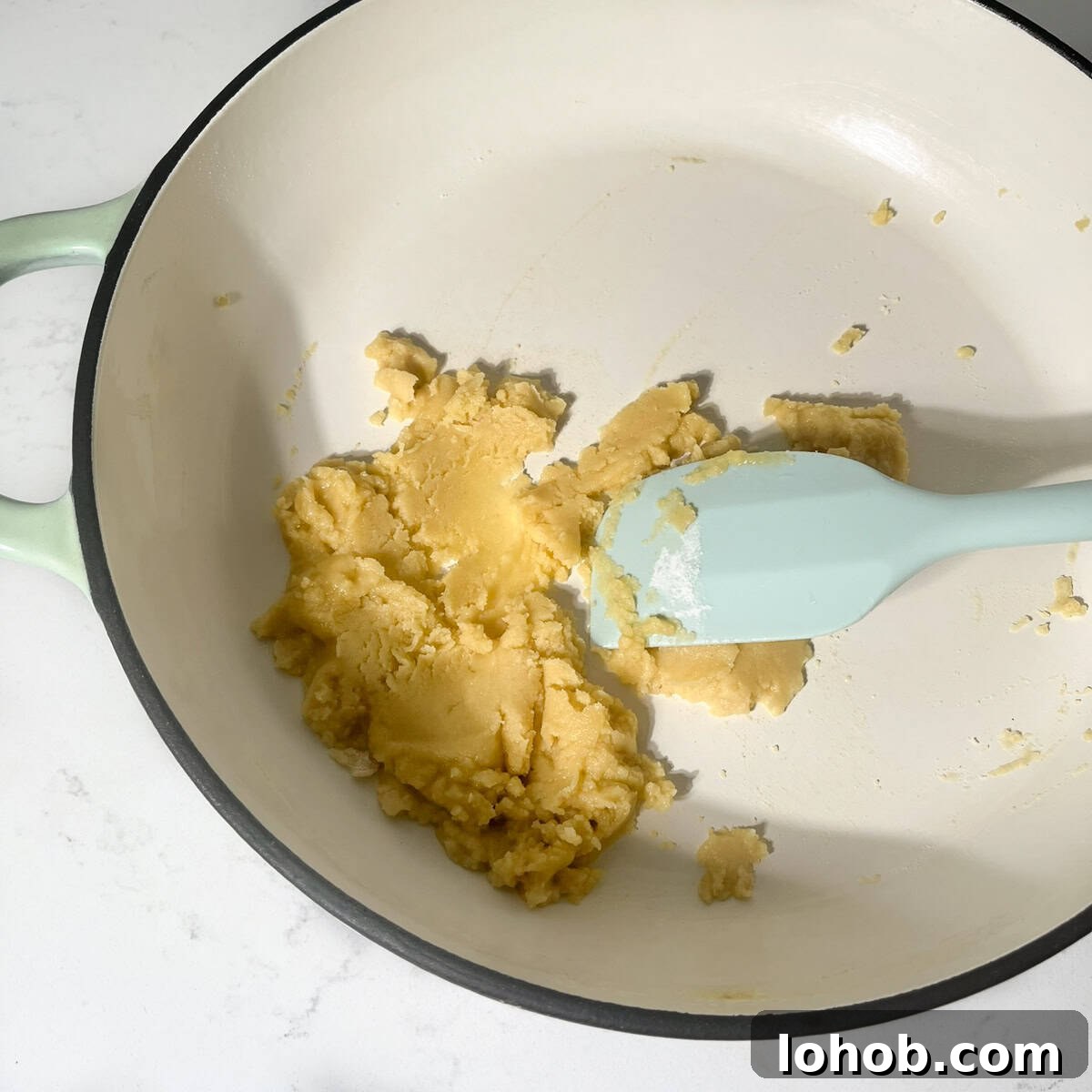 Creamy Baked Three-Cheese Macaroni with Garlic Parmesan Crumb Top 4 Making the roux with butter and flour in a large saucepan.