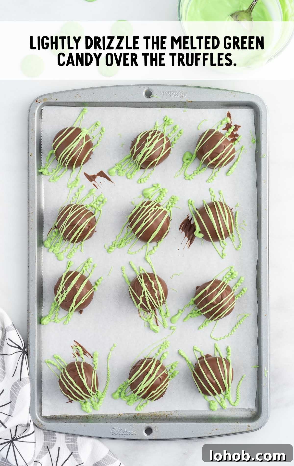 melted green candy drizzled over the truffles
