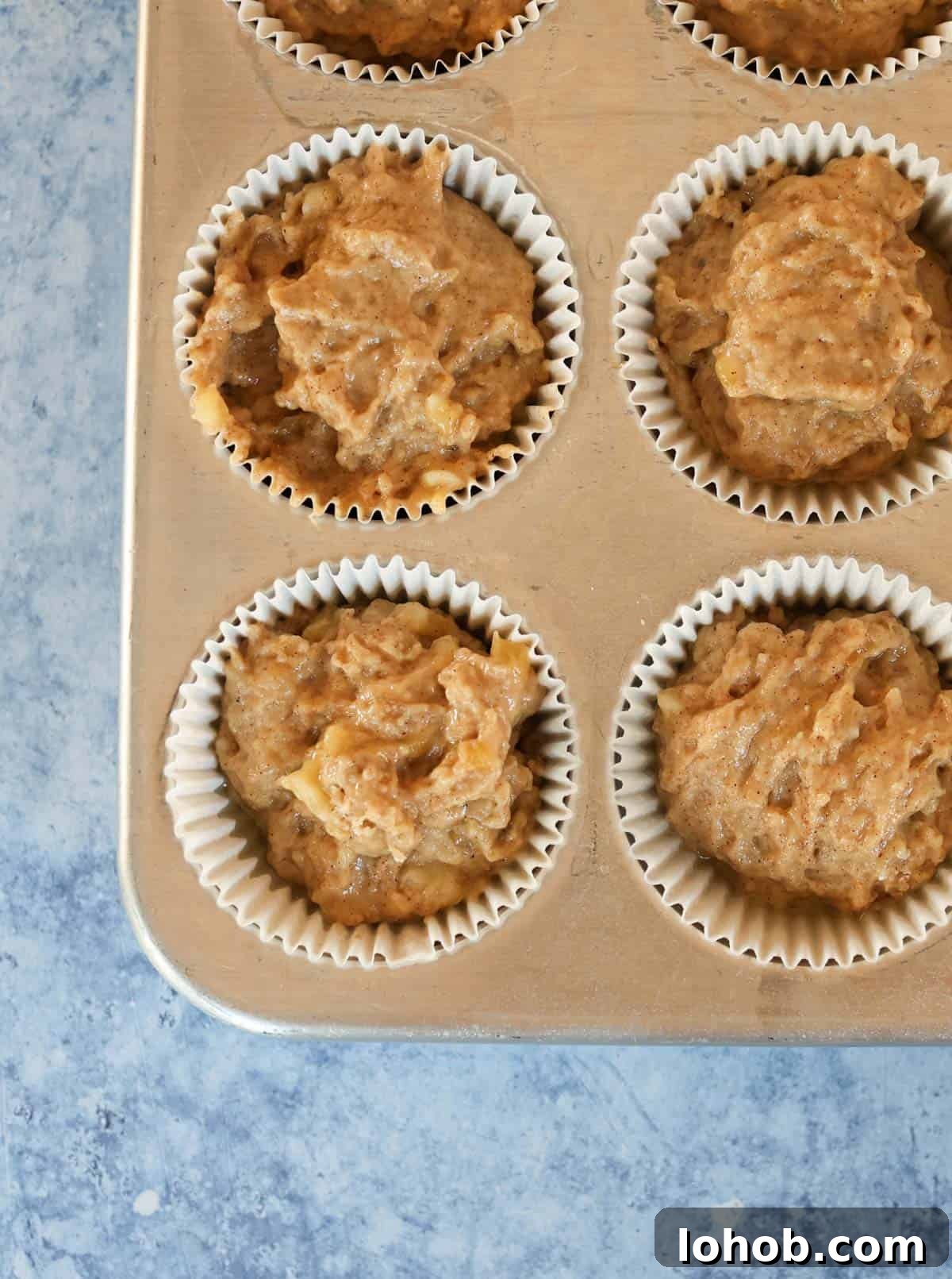 Banana bread muffins in a muffin tin.