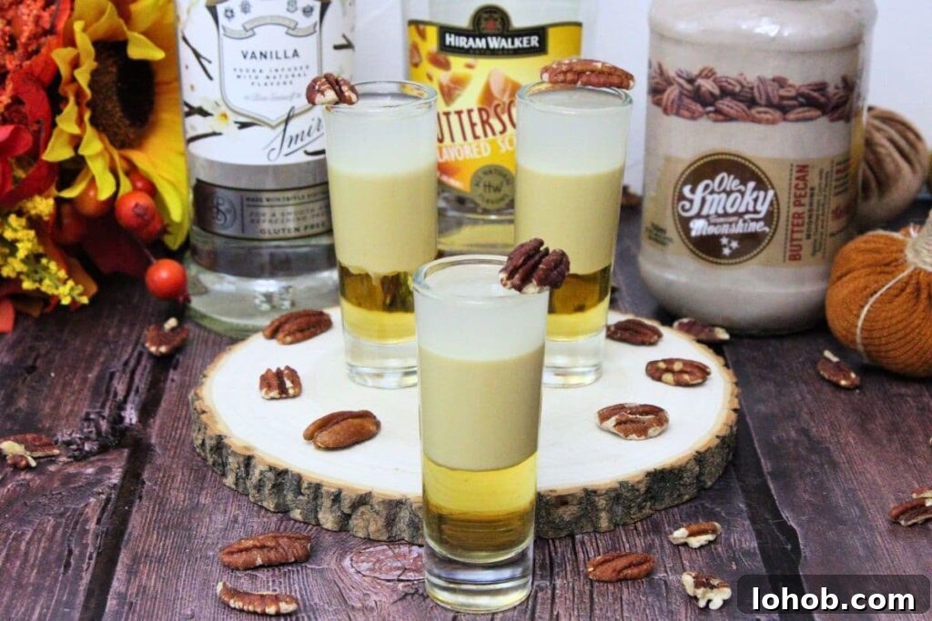 Pecan Pie Shot Recipe: Thanksgiving Vodka Shooter Guide 3 pecan pie shots on a rustic stump with liquor bottles behind