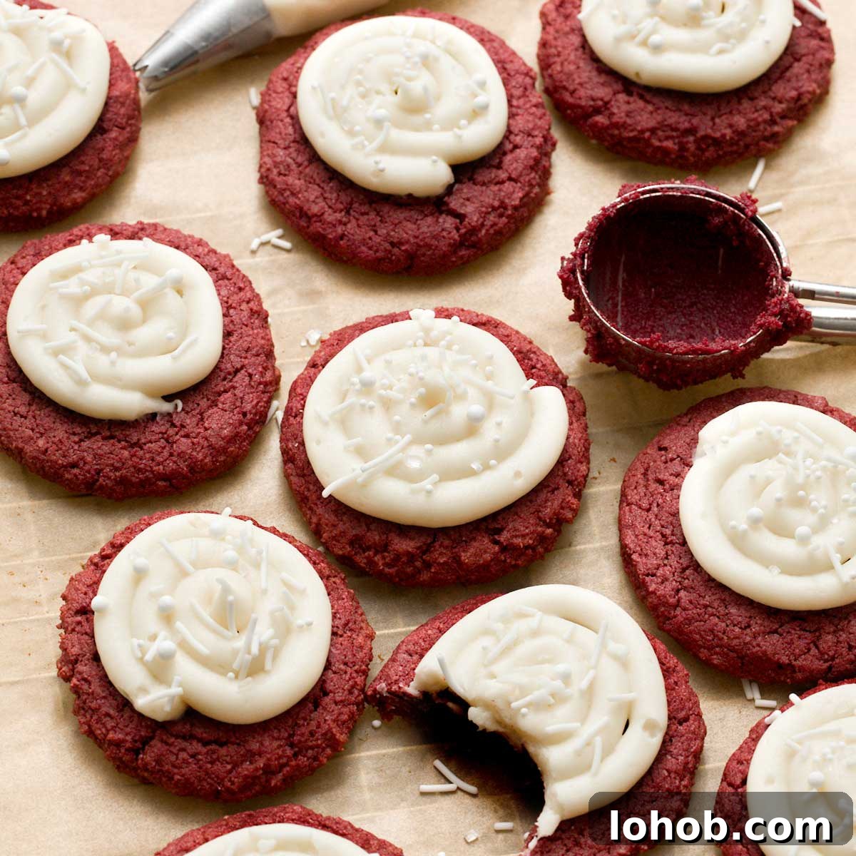 Gluten-Free Peanut Butter and Jelly Thumbprint Cookies 12 Gluten-free red velvet cookies with cream cheese frosting on parchment paper.