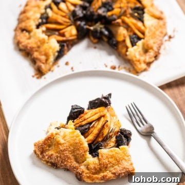 Flaky Rustic Fruit Galette Recipe for Perfect Summer Desserts 7 slice of Apple & Prune Galette recipe with full galette behind