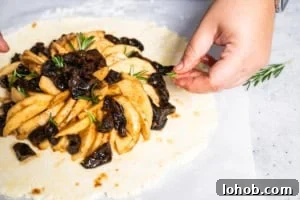 Flaky Rustic Fruit Galette Recipe for Perfect Summer Desserts 9 filling an apple and prune galette recipe to bake