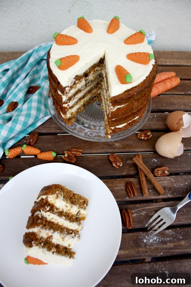 Super Moist Carrot Cake with Vanilla Cream Cheese Frosting - Serving on a White Plate