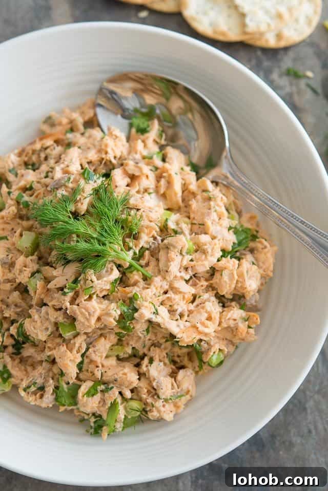 Fresh Mediterranean Salmon Salad with Lemon Herb Dressing 2 Salmon Salad - In a Bowl with Fresh Dill and Serving Spoon