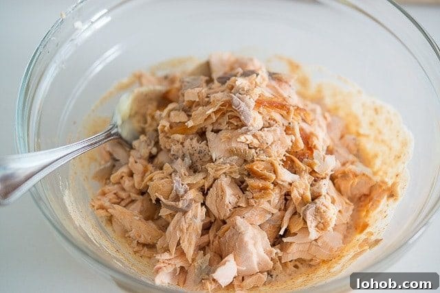 Fresh Mediterranean Salmon Salad with Lemon Herb Dressing 6 Flaked Fresh Salmon Added to Mayonnaise Dressing In Bowl