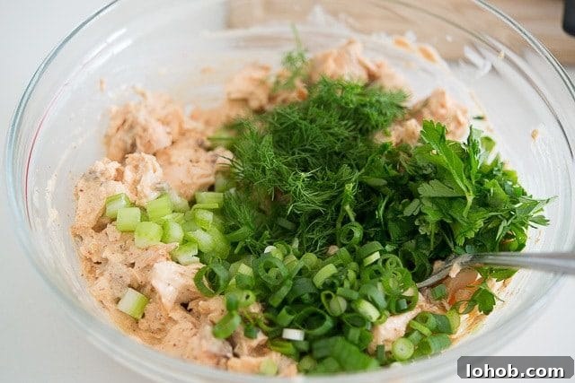 Fresh Mediterranean Salmon Salad with Lemon Herb Dressing 7 Green onion, dill, parsley, and celery Added to Salmon Salad Recipe In Bowl