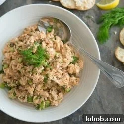Fresh Mediterranean Salmon Salad with Lemon Herb Dressing 9 Salmon Salad In a Bowl with Fresh Dill and Serving Spoon