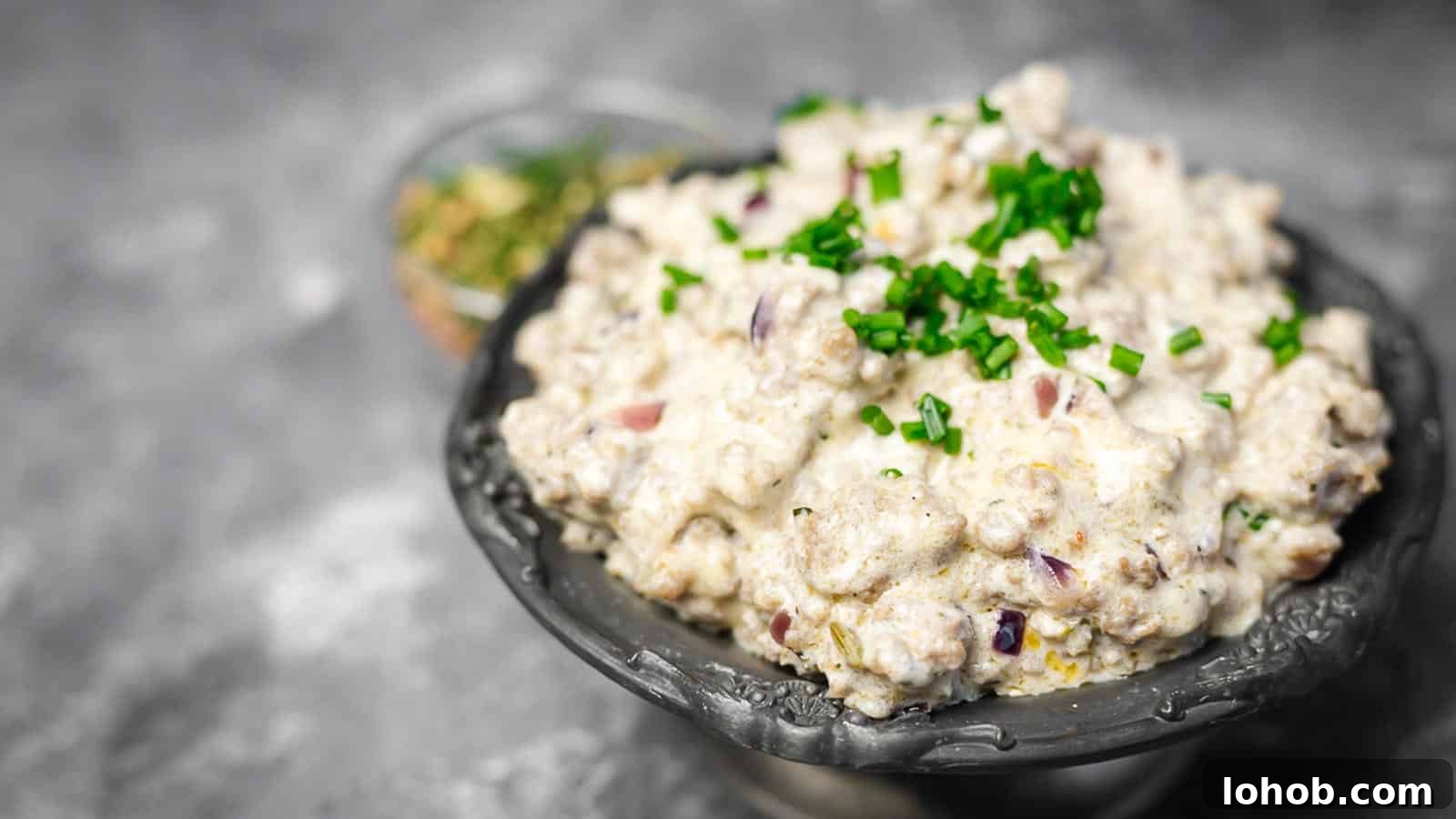 25 Morning Breakfast Ideas to Refresh Your Weekly Menu 11 Keto Sausage Gravy inside metal bowl.