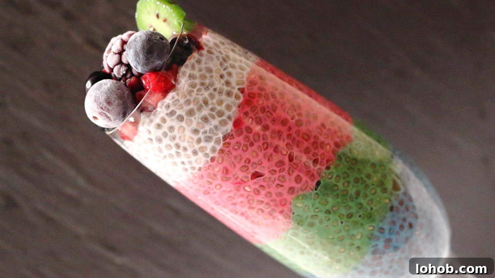 25 Morning Breakfast Ideas to Refresh Your Weekly Menu 4 Rainbow Chia Pudding with dark background in a glass.