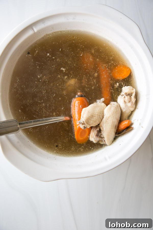 Gut-Healing Low FODMAP Chicken Stock Recipe (Gluten-Free) 7 Low FODMAP Chicken Stock in a Slow Cooker with Chicken Wings and Carrots