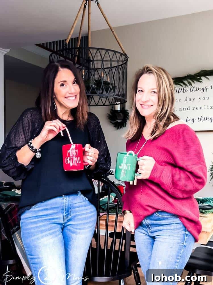 AnnMarie wearing black and Anne wearing red holding mugs