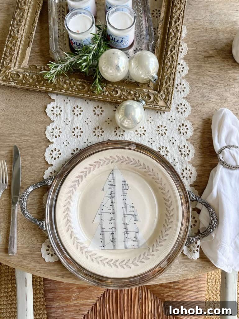 holiday table set with antiques and music sheet paper cutout on place setting