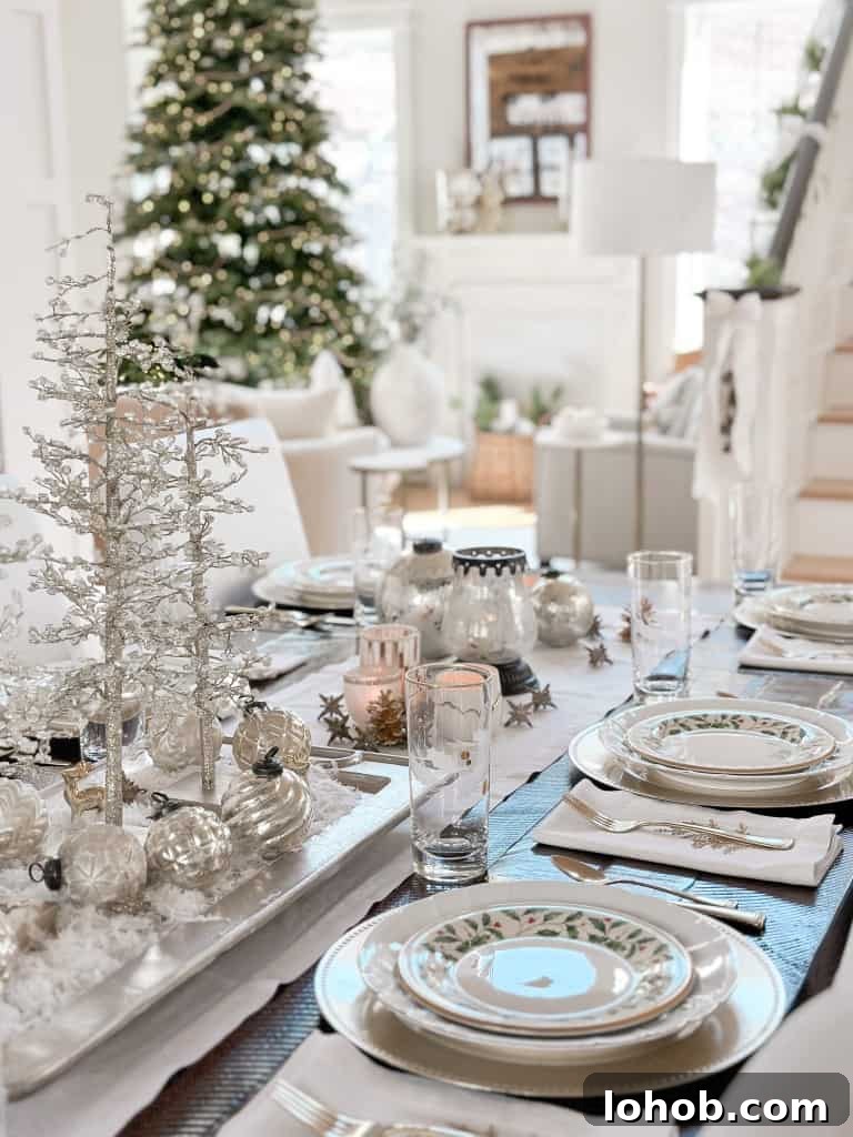 Christmas table decorated in silver, white and blue