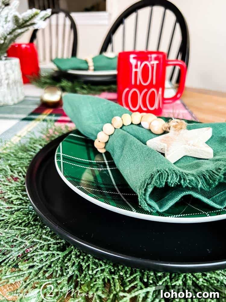 faux cedar placemat with plates stacked on top and green napkin in ring