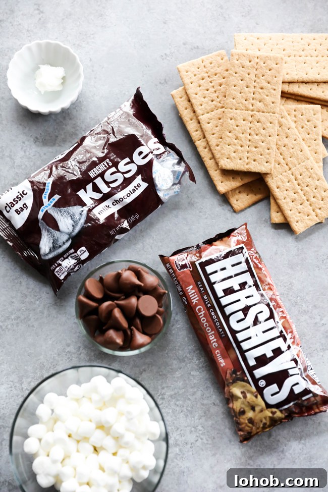 Hershey’s Kisses S’mores Bark Recipe: Chocolate Graham Delight 3 This HERSHEY'S KISSES S'more Bark could not be easier to make! This recipe is so delicious and perfect for a quick snack. It tastes just like the beloved s'more; only it is made in the comfort of your own kitchen. #sponsored HERSHEY'S Chocolate