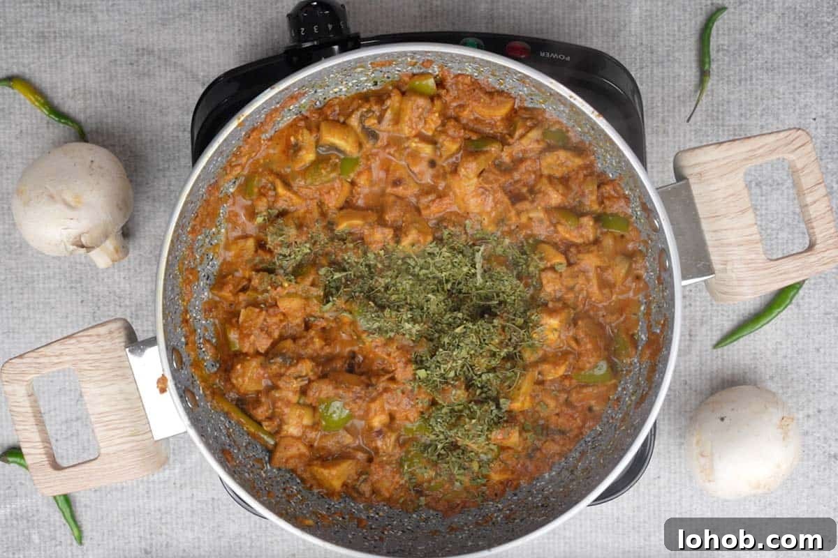 Lime juice and kasuri methi added to the pan.