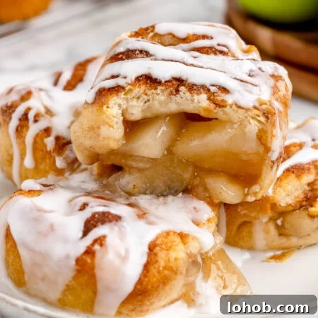 Mini Apple Pie Bites: Crispy Cinnamon Handheld Pastry Recipe 11 apple pie bites on a plate with glaze