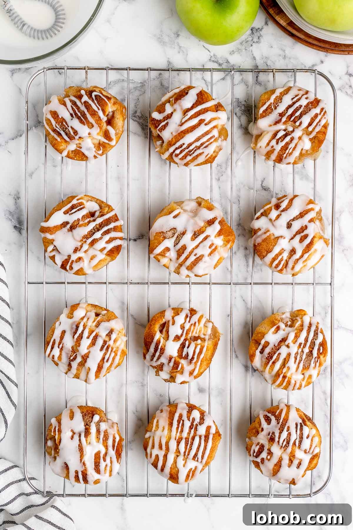 Mini Apple Pie Bites: Crispy Cinnamon Handheld Pastry Recipe 9 overhead of desserts on a cooling rack