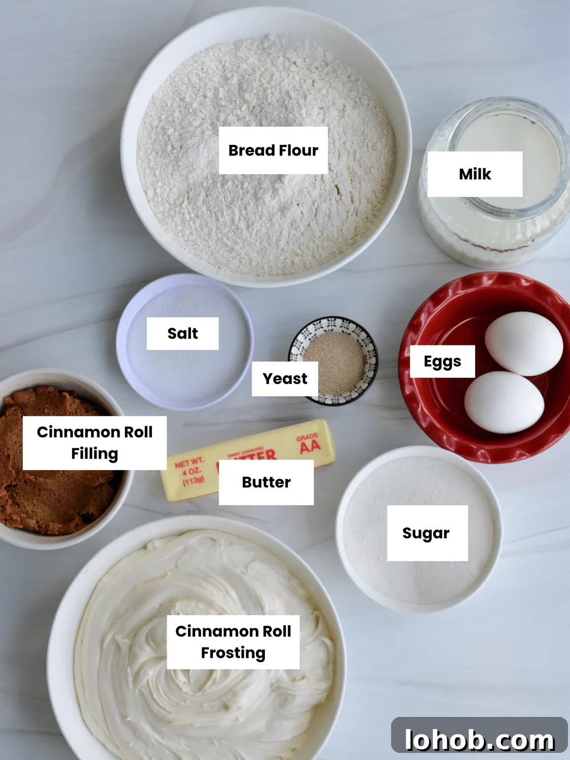 Soft Gooey Cinnamon Rolls Recipe for Perfectly Fluffy Layers 5 Ingredients labeled on a countertop.