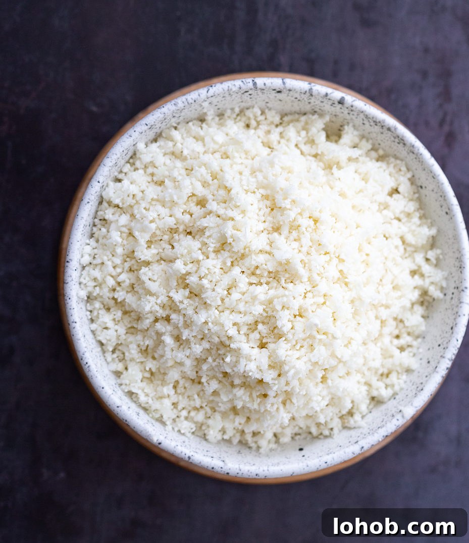 Golden Turmeric Cauliflower Rice with Garlic & Herbs 3 Lemony Turmeric Cauliflower Rice in a skillet