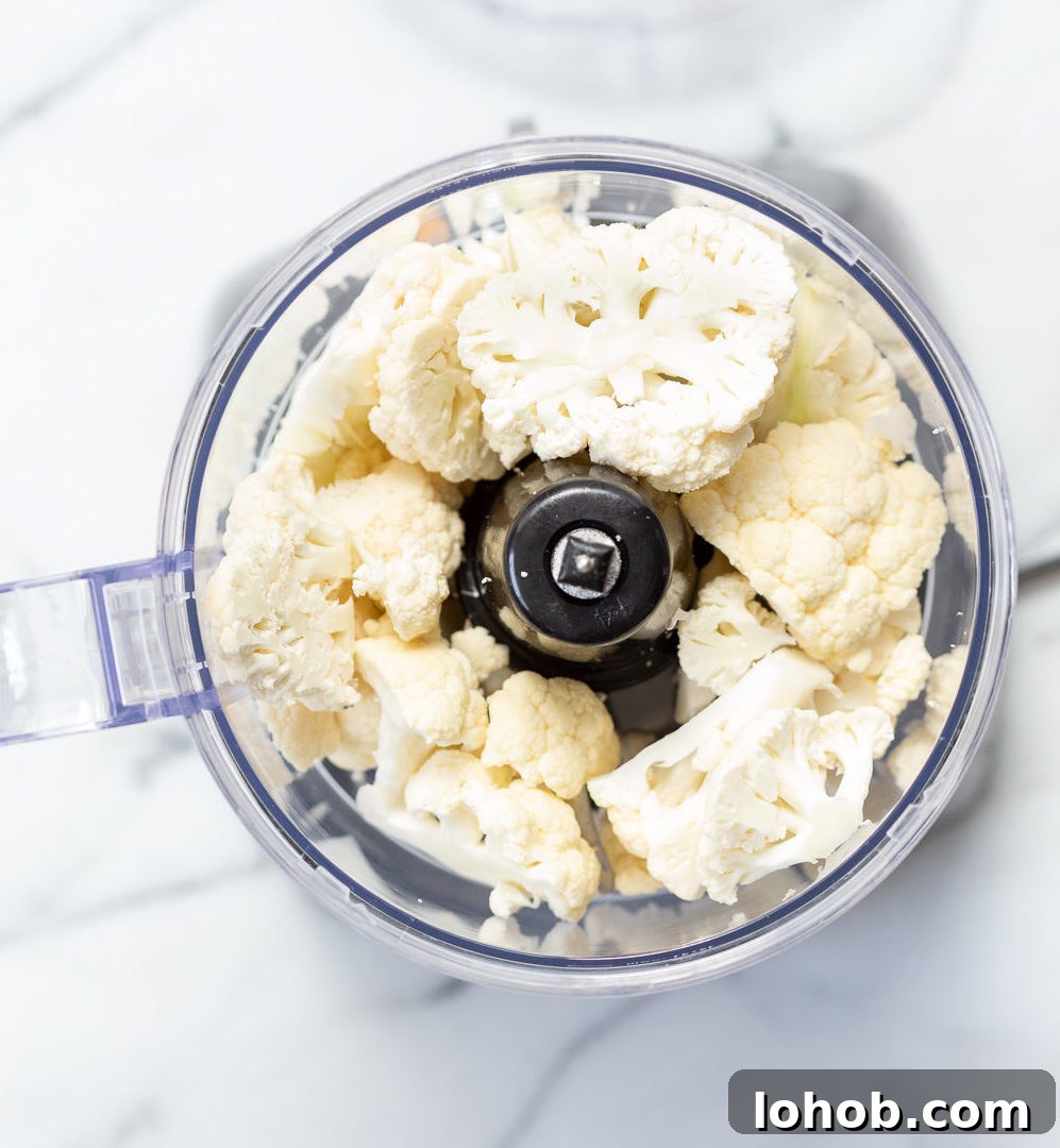 Golden Turmeric Cauliflower Rice with Garlic & Herbs 4 Cauliflower florets in a food processor