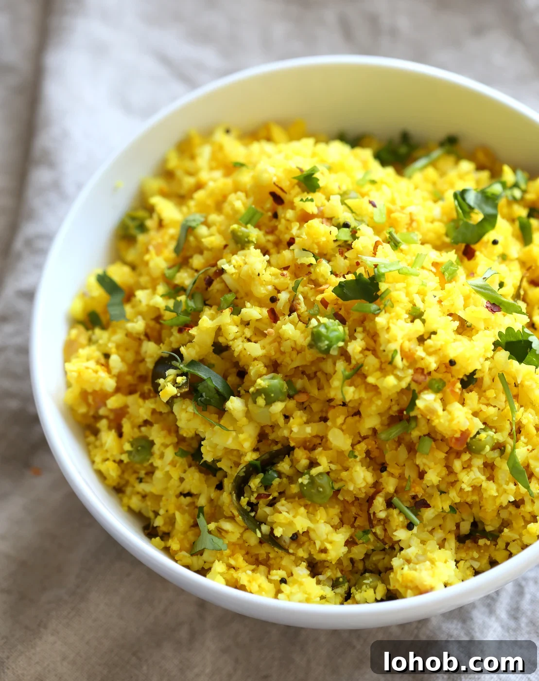 Golden Turmeric Cauliflower Rice with Garlic & Herbs 5 Vegan Turmeric Cauliflower Rice in a bowl