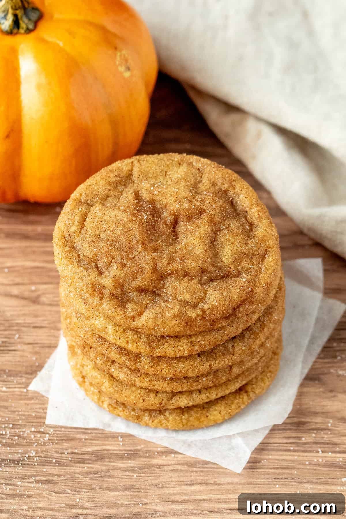 Stack of pumpkin spice cookies with cinnamon sugar coating