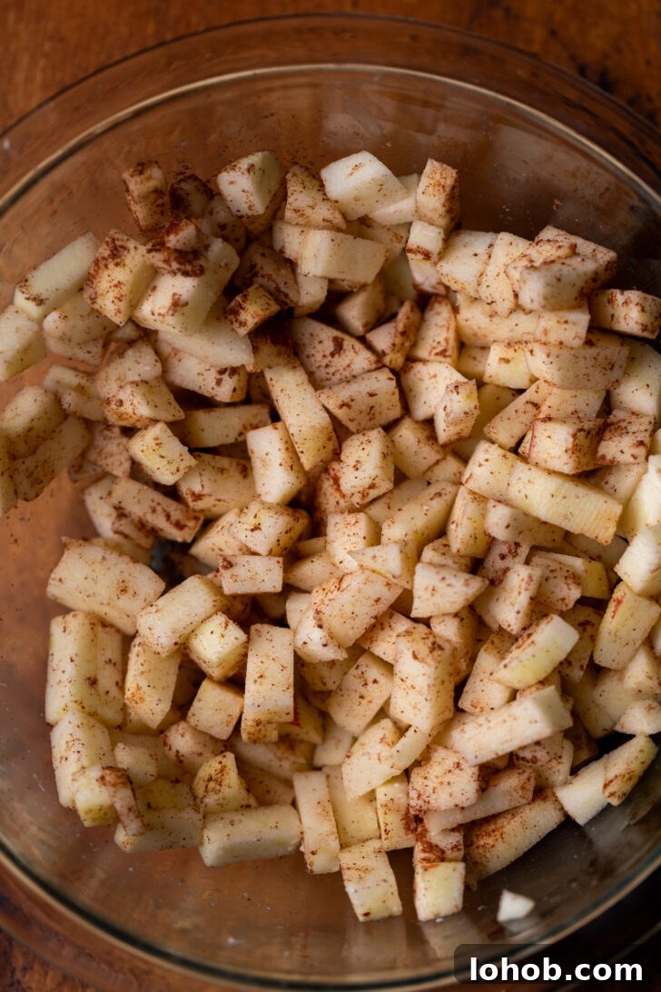 Moist Apple Muffin Recipe with Cinnamon Streusel 4 Diced apples in a bowl.