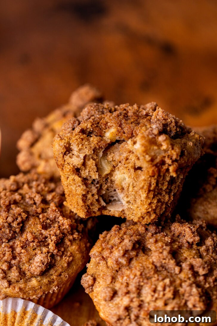 Moist Apple Muffin Recipe with Cinnamon Streusel 9 Muffins on top of each other.
