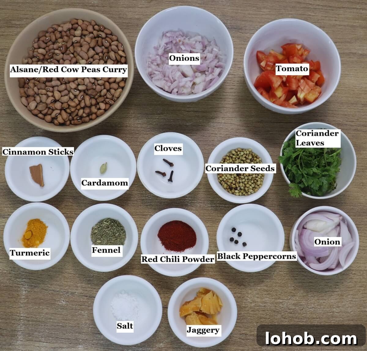 Individually labelled ingredients to make alsanyache tonak recipe are laid out on a table.