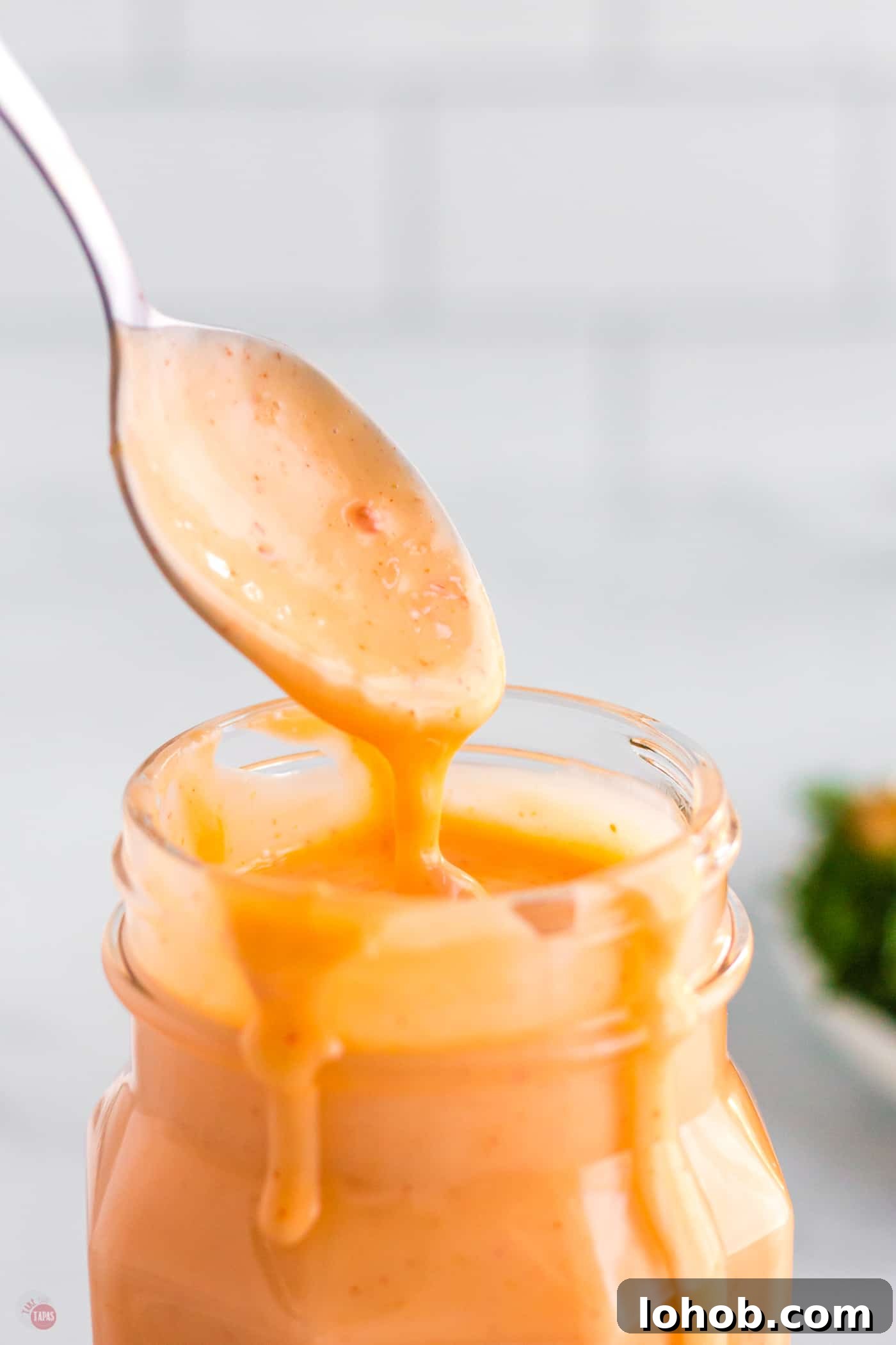 spoon dipping into a jar