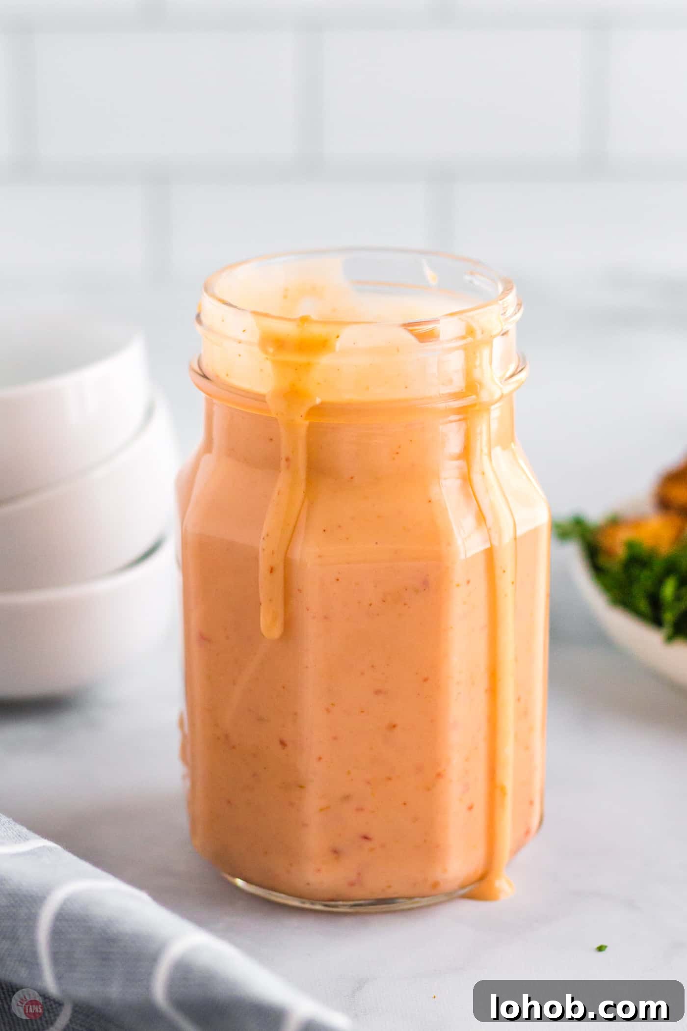 jar of sauce with drips