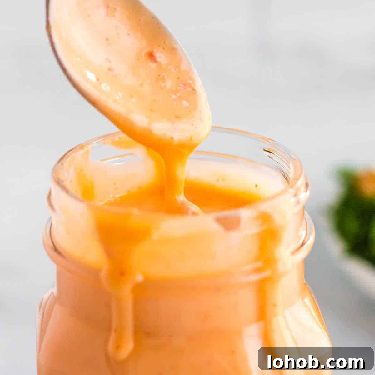 spoon and jar of boom boom sauce