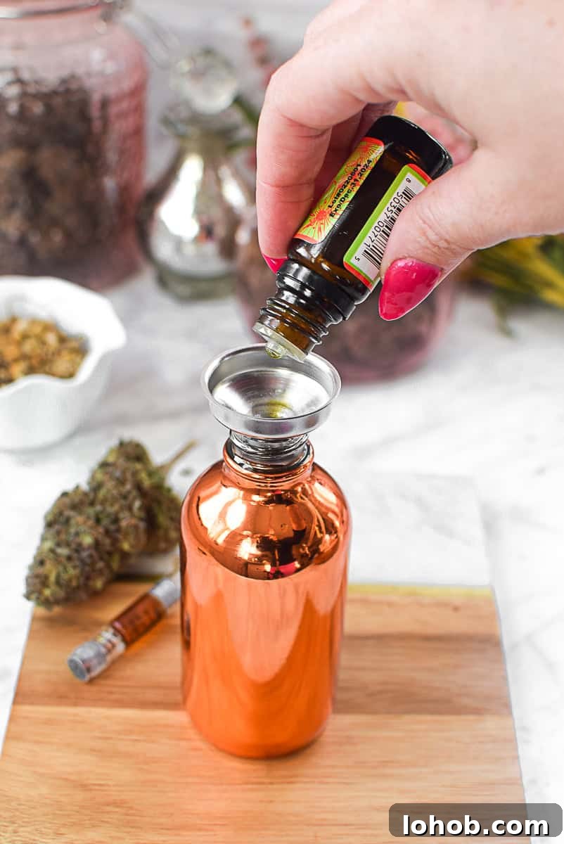 CBD oil being poured into a serum bottle for skincare.