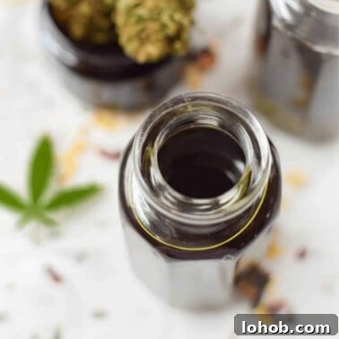 A glass bottle filled with cannabis massage oil.