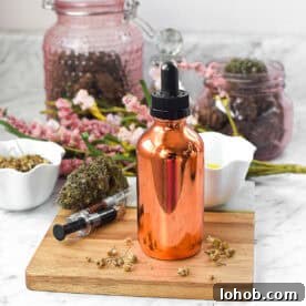 Copper dropper bottle with CBD oil for glowing skin, surrounded by herbs and flowers.
