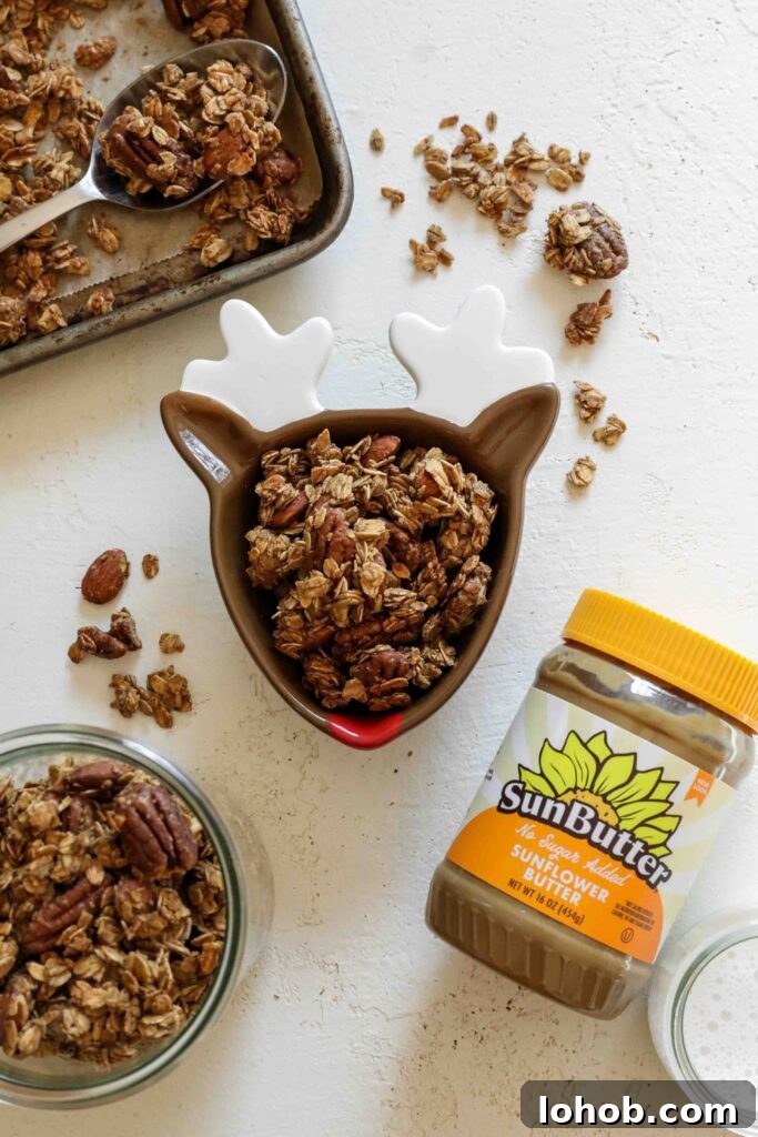 SunButter Gingerbread Granola served in reindeer bowl with SunButter and glass of milk by Flora & Vino