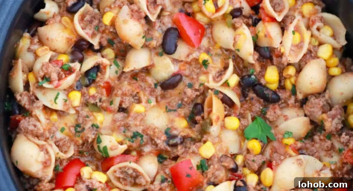 Overhead image of slow cooker taco pasta.