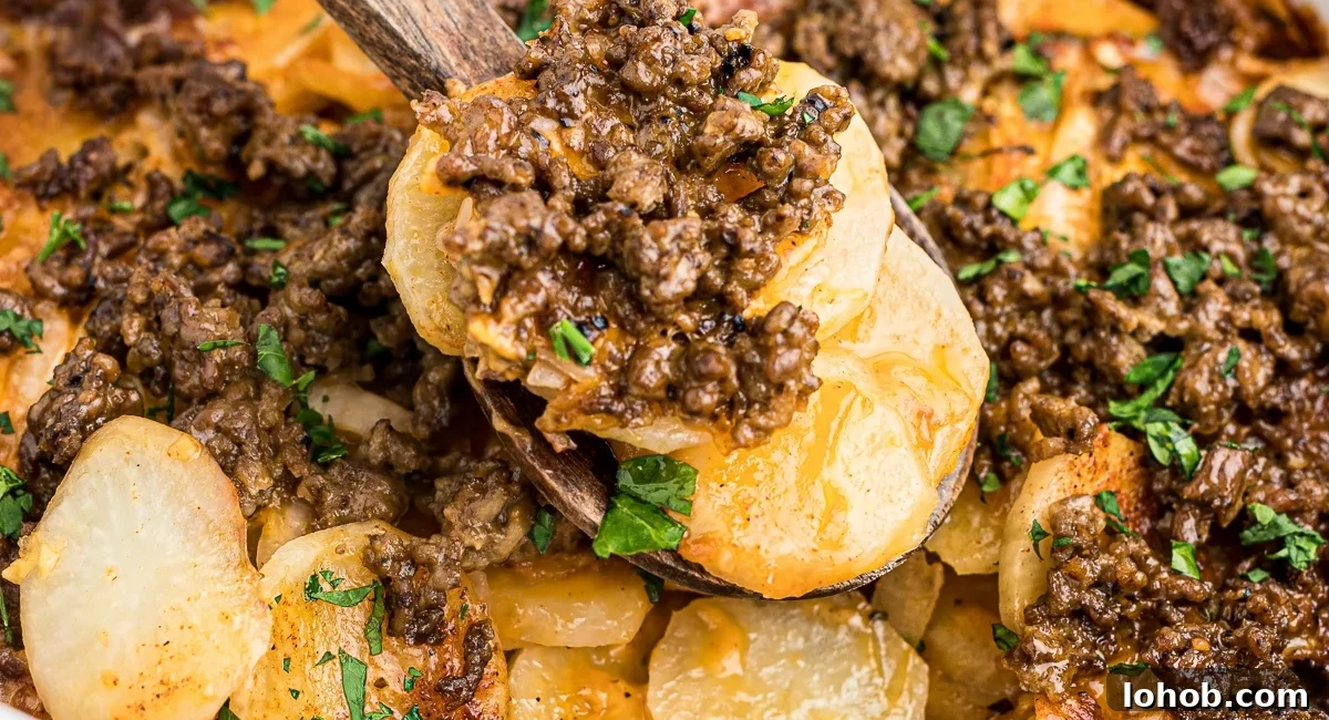 Up close image of slow cooker beef and potato au gratin with garnish.